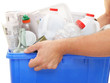 hands holding a recycle bin