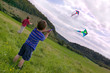 Two boys with kites.