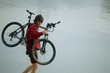 Biker carying bike