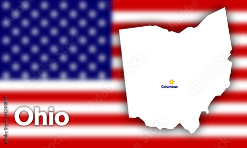 Ohio state contour with Capital City against blurred USA flag