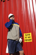 engineer against red freight container
