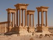 Four Ancient columns, ruins and a girl, Palmyra, Syria