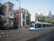 A view of a Train as it passes the Rijksmuseum