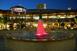 architectural view of an outdoor mall with fountain architectural view of an outdoor mall with fountain