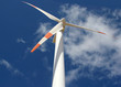 wind mill power generator against a cloudy blue sky wind mill power generator against a cloudy blue sky
