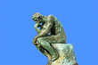 Thinker isolated over blue