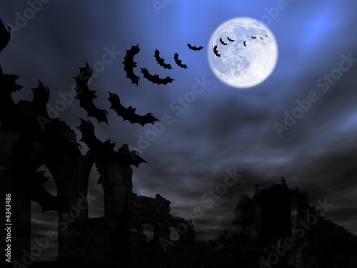 Halloween theme: batsflying over the old ruin against the Moon