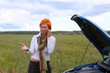 woman with her broken car.