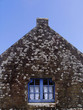 Wooden window and  stone house 