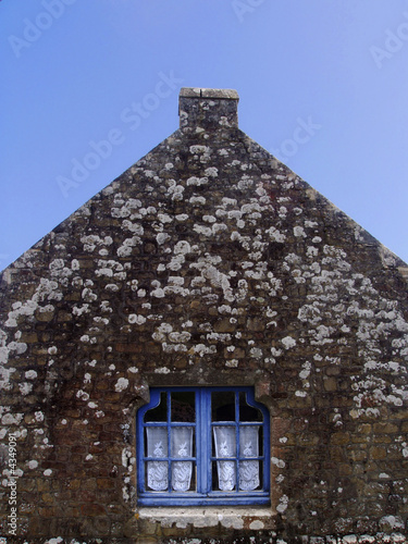 Photo: Wooden window and stone house Wooden window and stone house