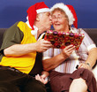 Elderly couple having a kiss at christmas