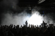 Photo en ligne au meilleur prix Cheering crowd at concert, musicians on the stage