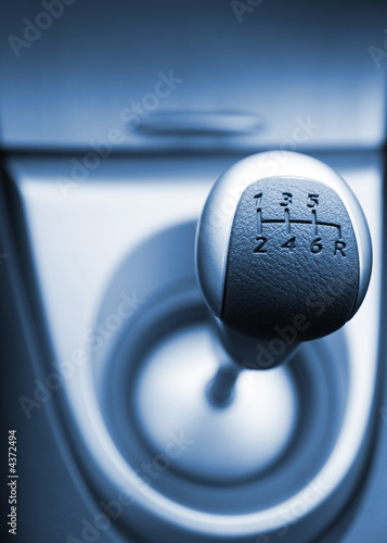 Six speed gear stick toned in blue (shallow DoF)