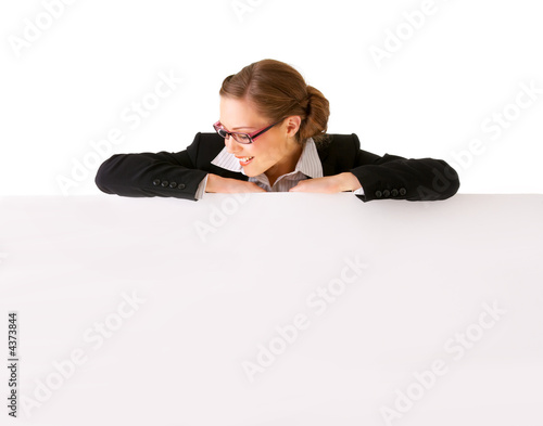 Businesswoman holding a billboard