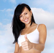 Foto: Happy woman giving thumbs up. Happy woman giving thumbs up.