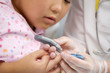 The doctor takes from the child blood. The doctor takes from the child blood.