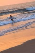 Photo: Female surfer heading for the last ride Female surfer heading for the last ride