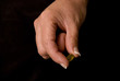 female hand holding pills
