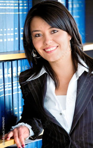 Photo: Business woman portrait in an office Business woman portrait in an office