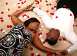 African American Couple Laying On The Floor With Rose Petal 2