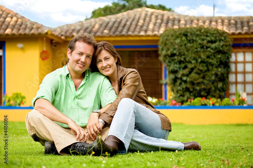 happy couple outside their home