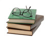 pile of books and eyeglasses pile of books and eyeglasses