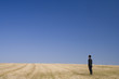 Businessman standing and thinking in the nature