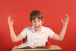 screaming child at desk