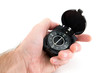 Compass in the hand on white Compass in the hand on white