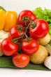 Cluster of tomatoes on vegetable background