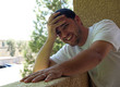 Man laughing on balcony Man laughing on balcony