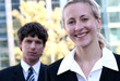 Businesswoman and businessman outdoors