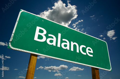 Illustration: "Balance" Road Sign with dramatic clouds and sky. "Balance" Road Sign with dramatic clouds and sky.