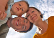 Happy family of three having fun outdoors