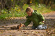 Little boy and squirrel