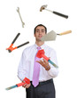 Businessman juggling hand tools Businessman juggling hand tools