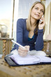 A young woman on the phone with her agenda