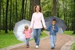 family walking on a rainy day