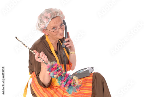 Photo: Cleaning lady on phone Cleaning lady on phone