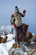 Yong woman travels in winter mountain