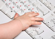 Photo: Baby hand with keyboard Baby hand with keyboard