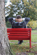 Photo: Businessman relaxing in a park Businessman relaxing in a park