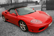 Bright red convertible sports car on a black and white backgroun Bright red convertible sports car on a black and white backgroun