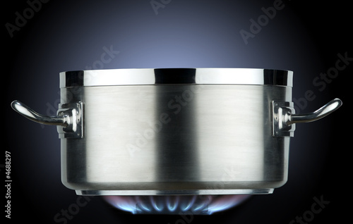 inox saucepan with gas flame  
