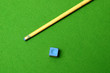 Photo: cue stick wit chalk block on green pool table cue stick wit chalk block on green pool table