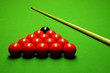Photo: Cue stick and snooker balls over green surface Cue stick and snooker balls over green surface