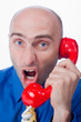 Businessman yelling into phone