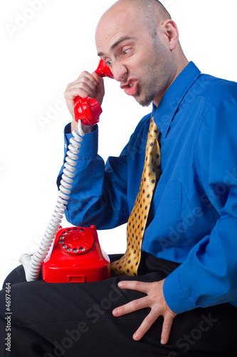 Photo: Upset businessman on phone Upset businessman on phone