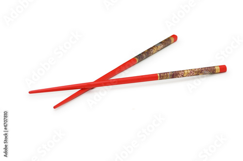 Red chopsticks isolated on the white background