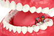 Miniature workers drilling teeth